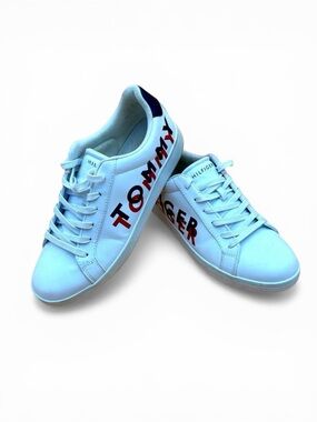 Tommy Hilfiger men’s size 12 white shoe with Logo on the side of each shoe.